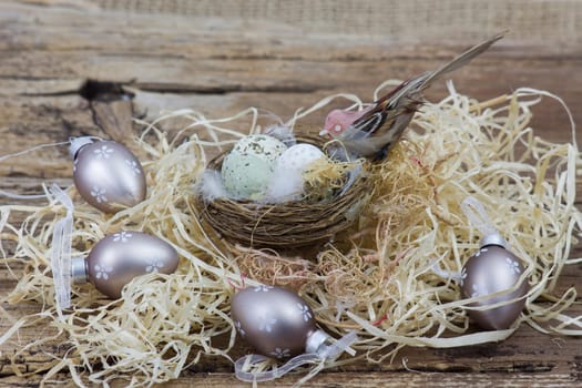 Easter decoration -  eggs in nest and bird