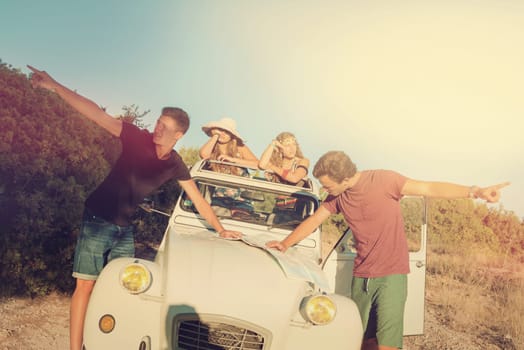 Vintage style image of boys with a map fighting over directions, and girls waiting in the car.