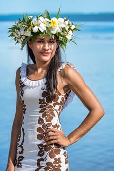 Young woman with flower wreath from Frangipani,semi-close,off the South Pacific,Raiatea,French Polynesia