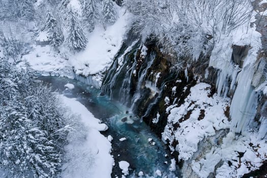 shirahige waterfall located 600 meters above sea leven in the Shirogane hot spring village of Biei City, this waterfall stands more than 30 meters tall. The water flowing down the gaps between the rocks resembles a white beard.