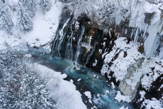 shirahige waterfall located 600 meters above sea leven in the Shirogane hot spring village of Biei City, this waterfall stands more than 30 meters tall. The water flowing down the gaps between the rocks resembles a white beard.