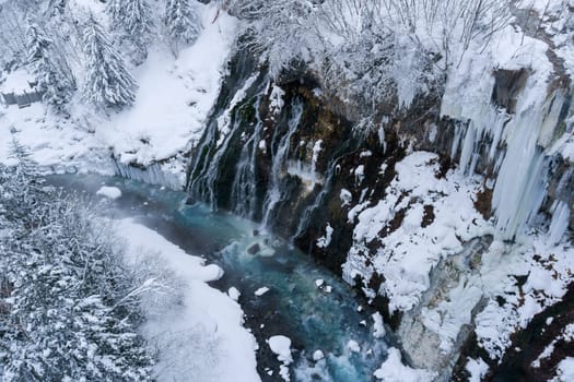 shirahige waterfall located 600 meters above sea leven in the Shirogane hot spring village of Biei City, this waterfall stands more than 30 meters tall. The water flowing down the gaps between the rocks resembles a white beard.