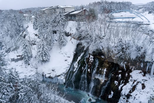 shirahige waterfall located 600 meters above sea leven in the Shirogane hot spring village of Biei City, this waterfall stands more than 30 meters tall. The water flowing down the gaps between the rocks resembles a white beard.