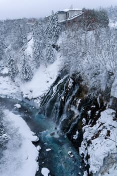shirahige waterfall located 600 meters above sea leven in the Shirogane hot spring village of Biei City, this waterfall stands more than 30 meters tall. The water flowing down the gaps between the rocks resembles a white beard.
