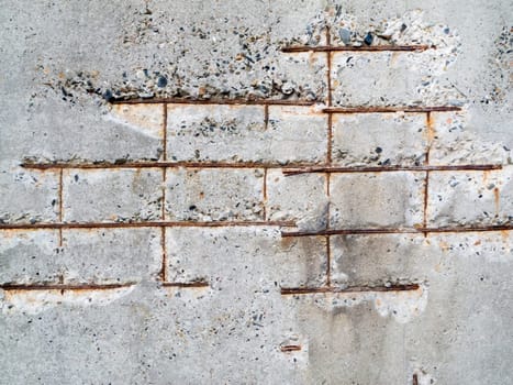 Full-size view on a damaged concrete wall with translucent iron.