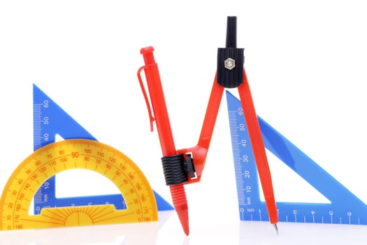 School drawing tools. Compass, triangle, ruler on white background