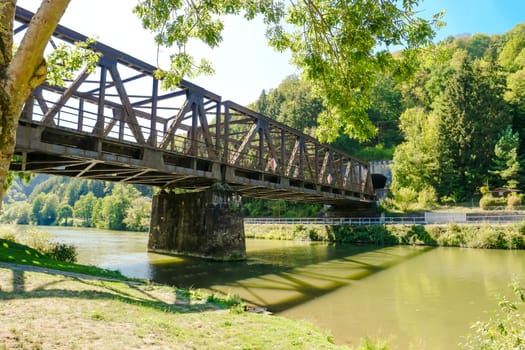 Idyllic Lahn River with iron Railway Bridge in Summer