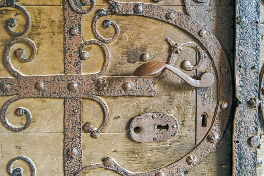 Old Door handle on a wooden Door in Detail