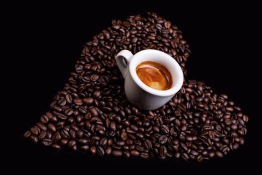 heart of coffee beans with espresso cup