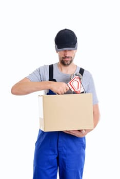 friendly postman with parcels in front of white background