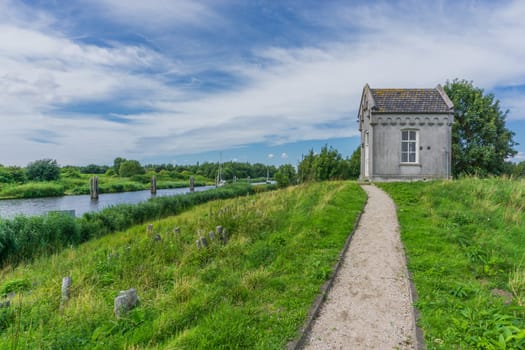 small lodge with walking path near the canal