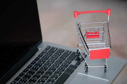 shopping cart on laptop, online shopping concept