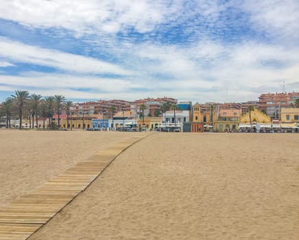 beach city view in spain blue sky and spanish buildings