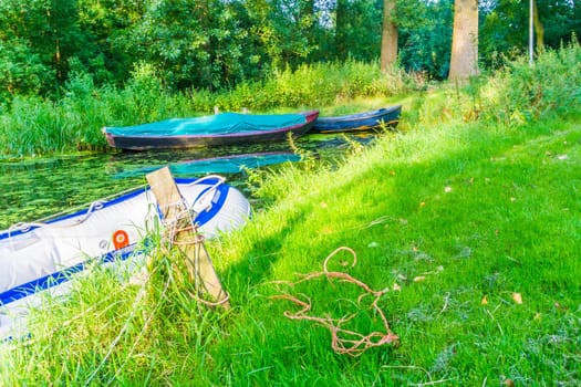 plastic inflatable rescue vessel in the river landscape