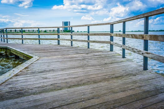 big pier with water and looking out on the city
