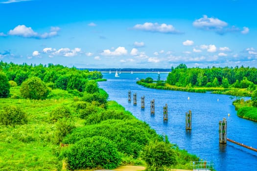 beautiful river landscape with poles and boats sky view
