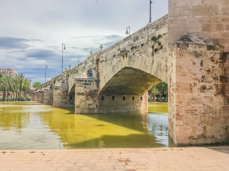 Old styled stone bridge with water front view