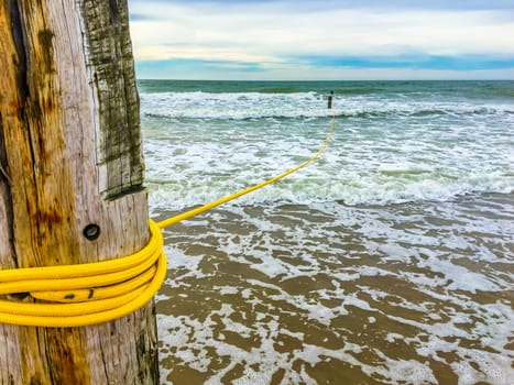 Rope line on a wooden pole in the ocean wild sea landscape