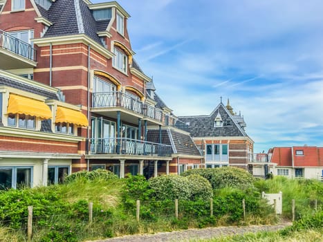 beautiful old vintage stylish house buildings with walking track and plants at Domburg the Netherlands