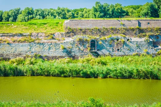 huge stone wall at the river