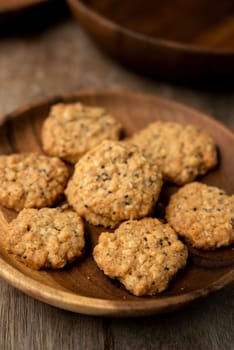 Vegan oatmeal chiaseeds cookies on plate with natural light.