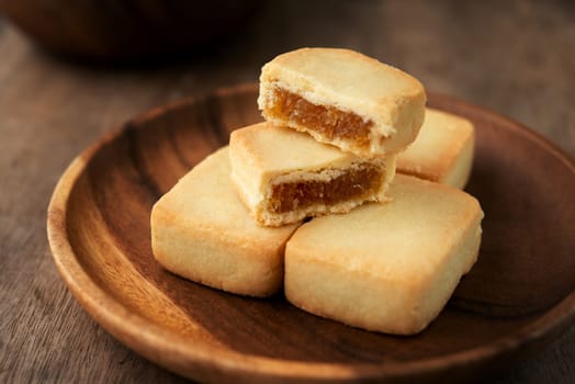Pineapple cake is a sweet traditional Taiwanese pastry containing butter, flour, egg, sugar, and pineapple jam.