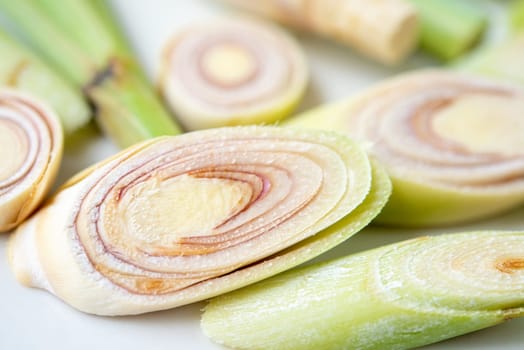 Fresh green lemongrass slices isolated on white background.