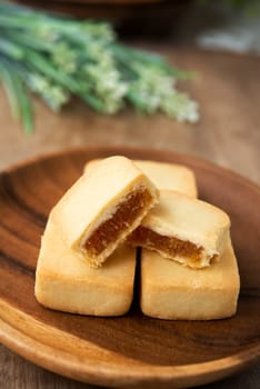 Pineapple cake is a sweet traditional Taiwanese pastry containing butter, flour, egg, sugar, and pineapple jam.