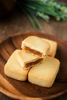 Pineapple cake is a sweet traditional Taiwanese pastry containing butter, flour, egg, sugar, and pineapple jam.