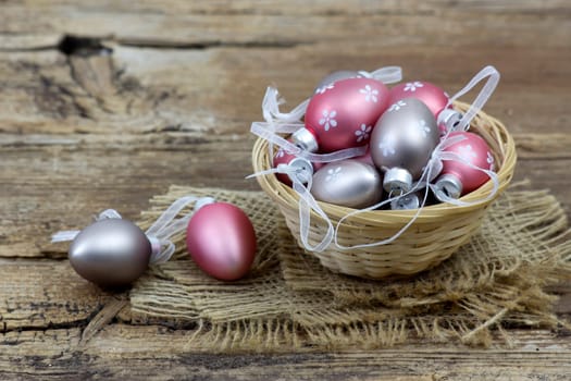 Easter decoration -  colorful painted eggs in a basket