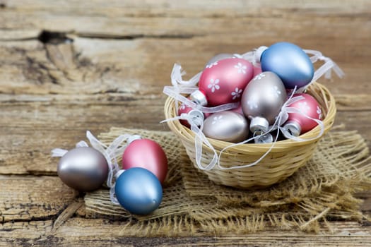Easter decoration -  colorful painted eggs in a basket