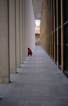 A Tourist photographes between the modern square pillars of the Rhein Main Congress Center..