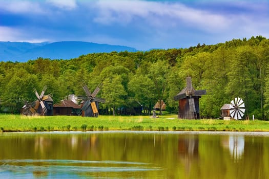 Windmills on the Bank of Lake in Romania