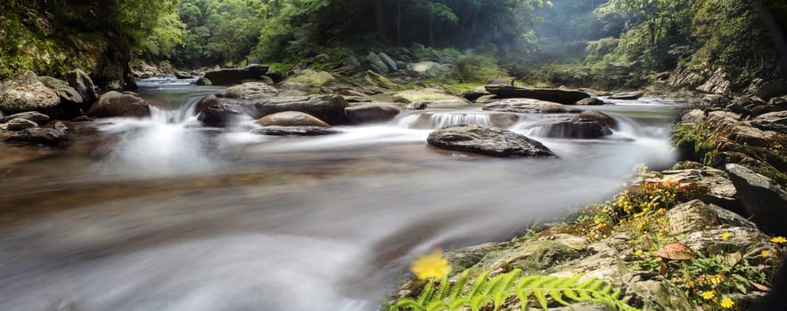 The Picture of some small waterfall at a nature river