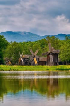 Windmills on the Bank of Lake in Romania