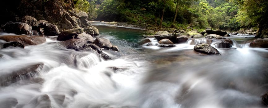 The Picture of some small waterfall at a nature river