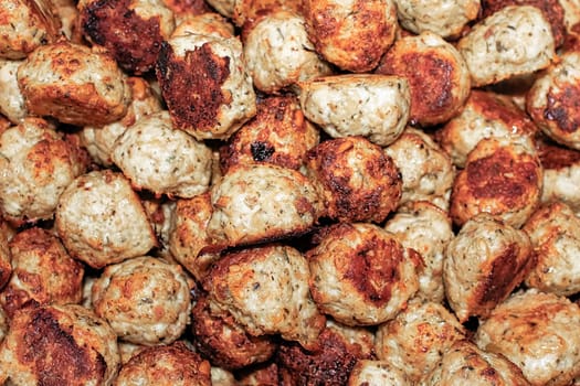 Background image of a pile of turkey meatballs.