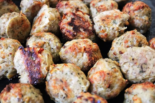Closeup of freshly baked parmesan turkey meatballs.