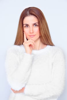 Beautiful woman with closed eyes meditates with her hands in front of her face
