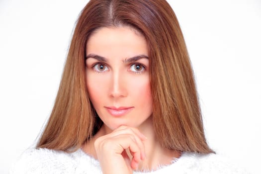 Beautiful woman with closed eyes meditates with her hands in front of her face