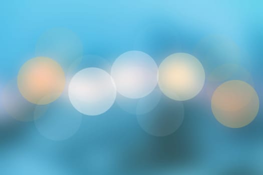 Abstract blue blurred pastel bokeh lights background texture. Beautiful spring or summer illustration.