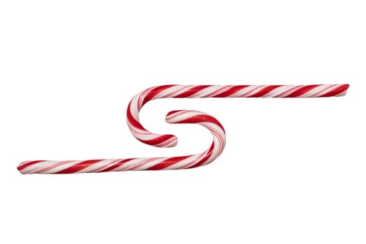Traditional Christmas striped candy cane isolated on a white background. Top view.
