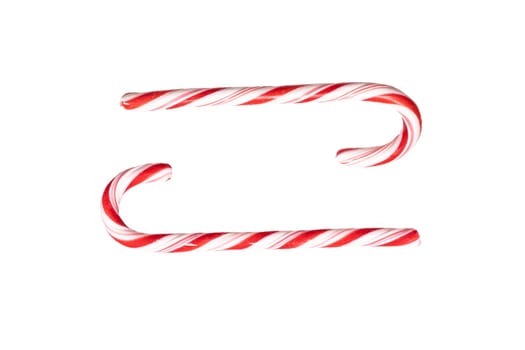 Traditional Christmas striped candy cane isolated on a white background. Top view.