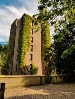 Flat high brick house block with tower