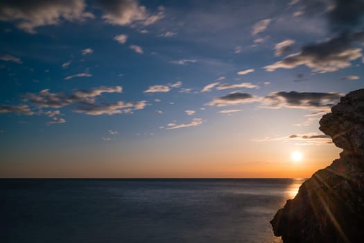 Beautiful sunset over the cliffs in Petrovac coast, Montenegro