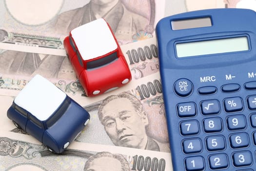 toy car and calculator with ten thousand japanese yen