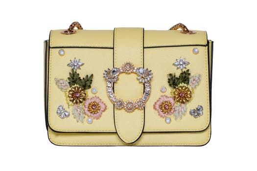 Fashionable yellow female luxury women bag isolated on a white background. Fashionable womans accessories.