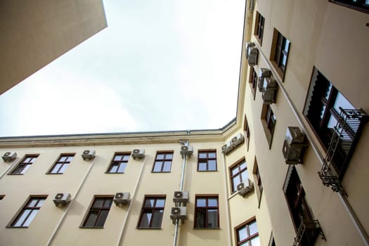 House view from the bottom up at the sky. House with air conditioning in Old Riga, Latvia.