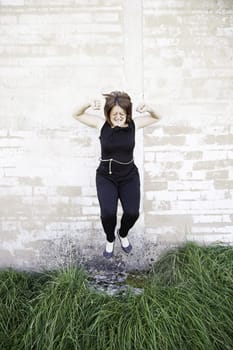 Girl jumping street screaming and stressed people