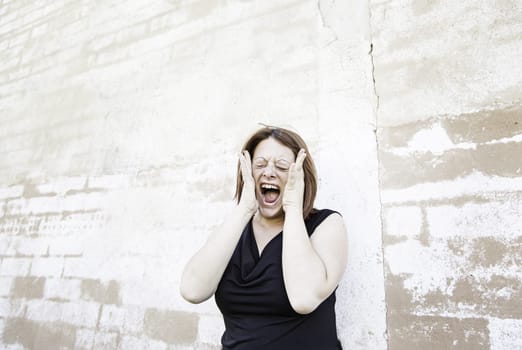Girl screaming in uncontrolled urban street, madness